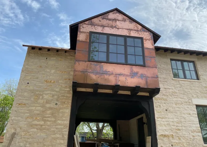 Copper metal panel facade on a stone building for Metal Roof Coating in Johnson City